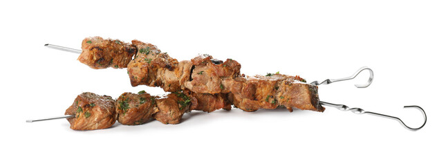 Metal skewers with delicious meat on white background