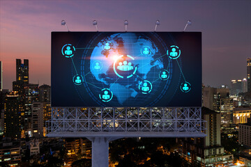 World planet Earth map hologram and social media icons on billboard over night panoramic city view of Bangkok, Southeast Asia. Networking and establishing new connections between people. Globe