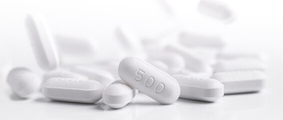 White drug tablets with spilled on floor.Medicine pills with spilled or Falling down, medicine size...