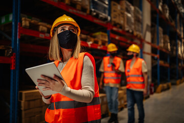 Warehouse worker with face masks during and after coronavirus pandemic