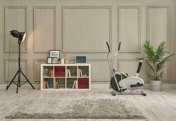 Decorative sport room concept with bike and home decoration background with bookshelf carpet and lamp.