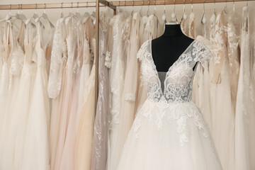 Beautiful wedding dress on mannequin in boutique