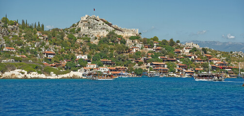Ships with tourists on board sail to the port and stand there