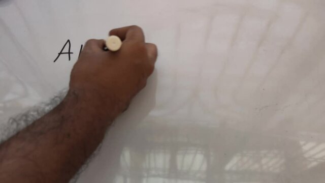 AHS Covid Vaccine written on a white background with a marker pen