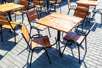 Tables and chairs of traditional summer street cafe