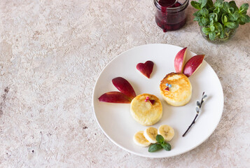 Creative idea for a kids breakfast, rabbit made from cheesecakes and fruits. food art idea. Children, holidays, summer, Easter, healthy, proper nutrition concept. Free space for text. Baby food. Food 