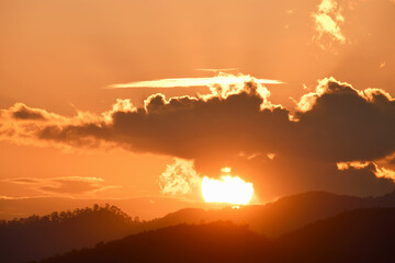 Fototapeta premium Rain cloud with evening sunset light.