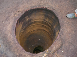 Amazing stone hole the hole is like a pot is a natural hole. The hole is the largest group in Thailand. There are no less than 16 holes with many sizes ranging from 40 -300 cm wide mouth - 10 m. deep - obrazy, fototapety, plakaty