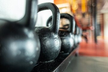 Kettlebells on the background of the interior of the gym without people