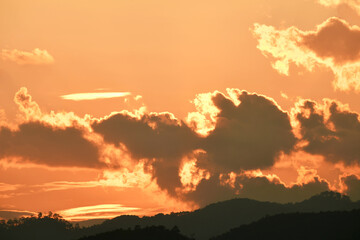 Rain cloud with evening sunset light.