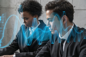 Two businesspeople working on market behavior. Trading concept. Financial graph hologram. Multiexposure.