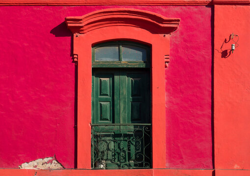 Red Facade Of An Old Colonial House In Luanda, Angola