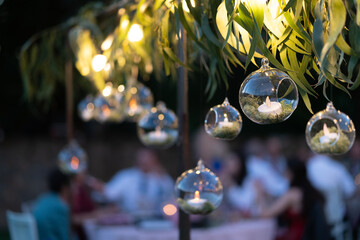 Decoration with candles inside crystal balls in a wedding