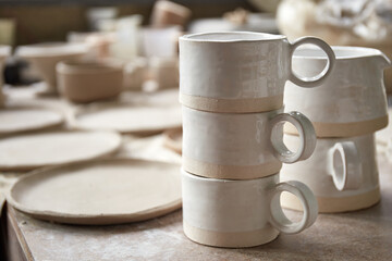 Pottery studio The process of creating pottery. The master ceramist works in her studio. workplace of potter