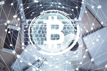 Blockchain theme hologram drawings over computer on the desktop background. Top view. Double exposure.
