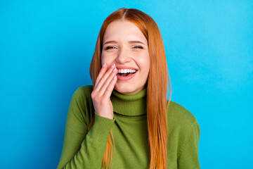 Portrait of charming cheerful girl laughing having fun good mood isolated over bright blue color...