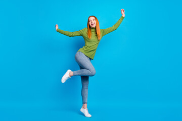 Obraz premium Full length body size view of pretty carefree cheerful funny girl jumping having fun dancing isolated over bright blue color background