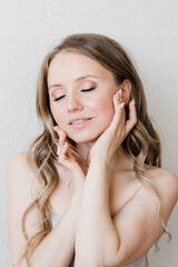 Fototapeta premium light makeup on a beautiful young girl close-up