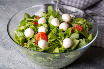 Purslane salad with cheese balls and olives inside. Healthy diet salad.