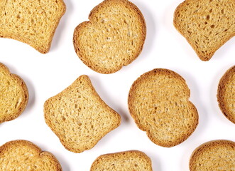 Wholemeal crackers, bread rusks pile, round and rectangle toast slices isolated on white background, top view, pattern