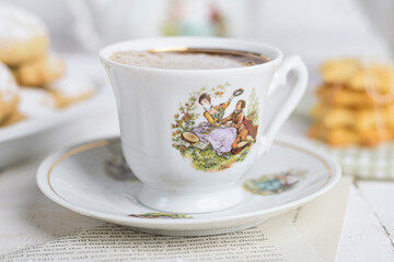 My sister spill the milk on chocolate hot drink to prepare breakfast with Eid Cookies which is called Kahk.
