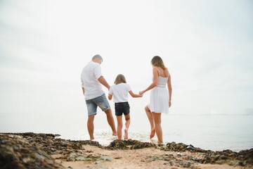 Cute happy family having fun on luxury tropical resort, summer holidays, love concept