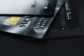 Stack credit cards, close up view with selective focus for background. Online credit card payment.