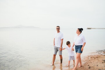 Cute happy family having fun on luxury tropical resort, mother with child, summer holidays, love concept
