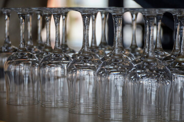 Glass clean goblets on the table. Waiting for guests. Service of visitors in a restaurant, café