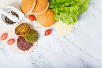 vegan cutlets and vegan burger. Raw vegan burgers made of beetroot, green peas, carrots, groats and herbs
