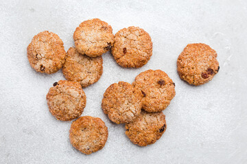 Few sweet oatmeal cookies on a light background