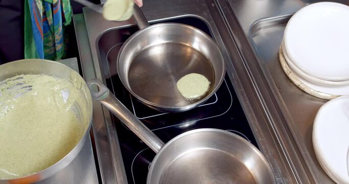 Close-up of the process of cooking delicious pancakes in a frying pan.
