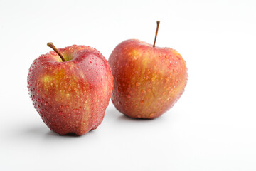 Fresh red apple with drops isolated on white background.
