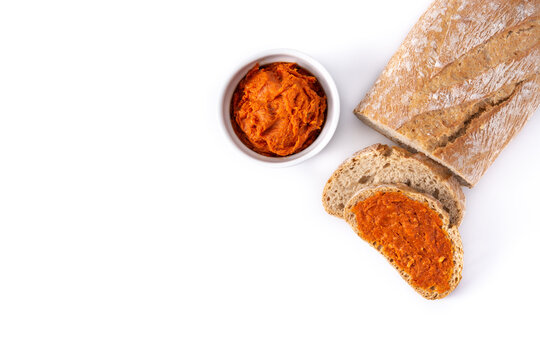 Sliced toast bread with sobrasada isolated on white background. Typical Mallorca food in Spain.	