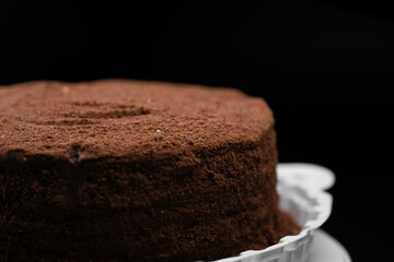 Fresh cake on black background