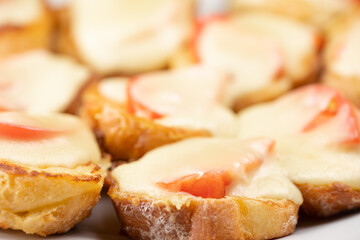 Baked bread with egg, cheese and tomatoes