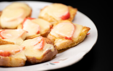 Baked bread with egg, cheese and tomatoes