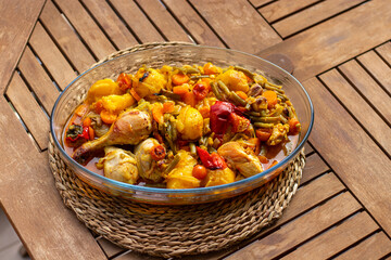 Roasted chicken with vegetables in a Jena glass bowl