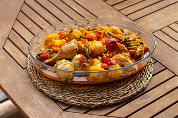 Roasted chicken with vegetables in a Jena glass bowl