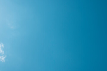 A clear beautiful blue sky with small clouds. Copy space. Pattern, blank, mock-up