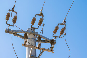closeup view of mains power line junction with insulator