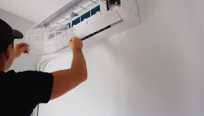 Air conditioner repair and maintenance. The engineer of the service organization carries out maintenance of the indoor unit of the air conditioner. Cleaning the filters. Ventilation repair.