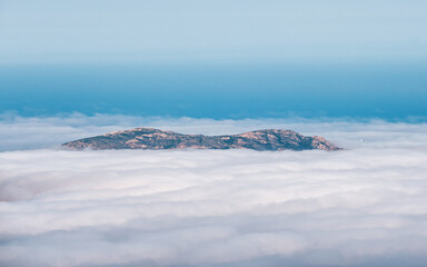 Fototapeta na wymiar La Revellata under veil of cloud in Corsica