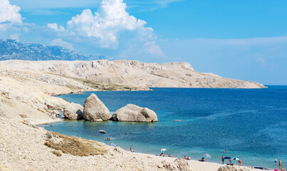 Spectacular view beautiful beach surrounded by rocky coastline on Pag island in Croatia.