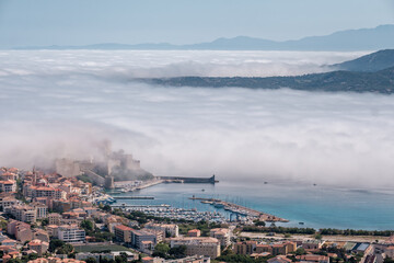 Citadel of Calvi in the mist in Corsica