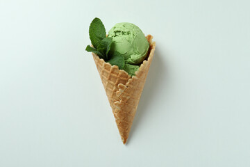 Cone of mint ice cream on white background