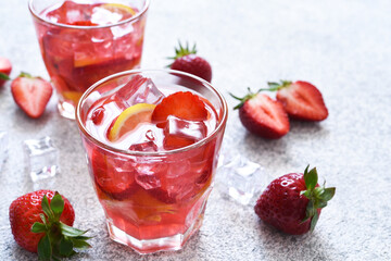 Strawberry lemonade with ice and mint, top view. Cold drink with strawberries.