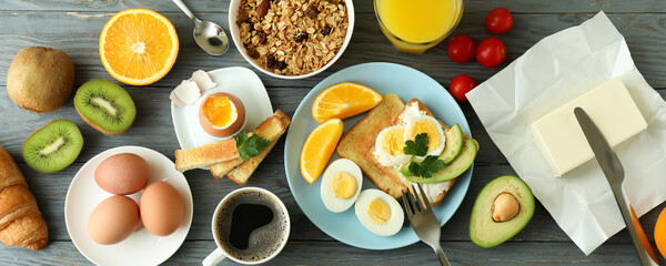 Concept of tasty breakfast on wooden table, top view