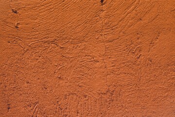 orange dirty venetian plaster with cracked paint texture - cute abstract photo background