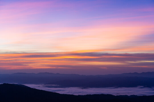 morning view with twilight sky on the top of the mountain names Doi swang or Phu Snan, Doi Phu Kha national park, Nan Province along the Luang Prabang Range in North Thailand